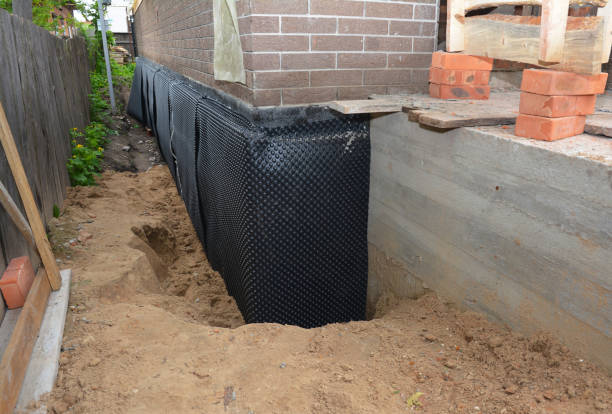 SJ Waterproofing Pros technician performing targeted Sump Pump Installation assessment in Ixonia, WI